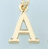Gold greek letter charm